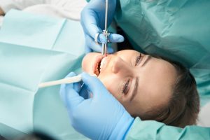 Dentist performing sedation dentistry procedure on patient in Ruidoso, NM.